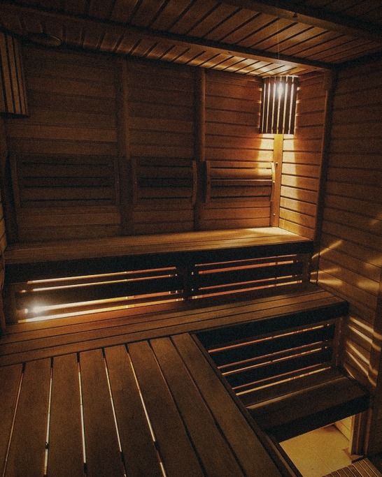 A timber sauna with warm light.